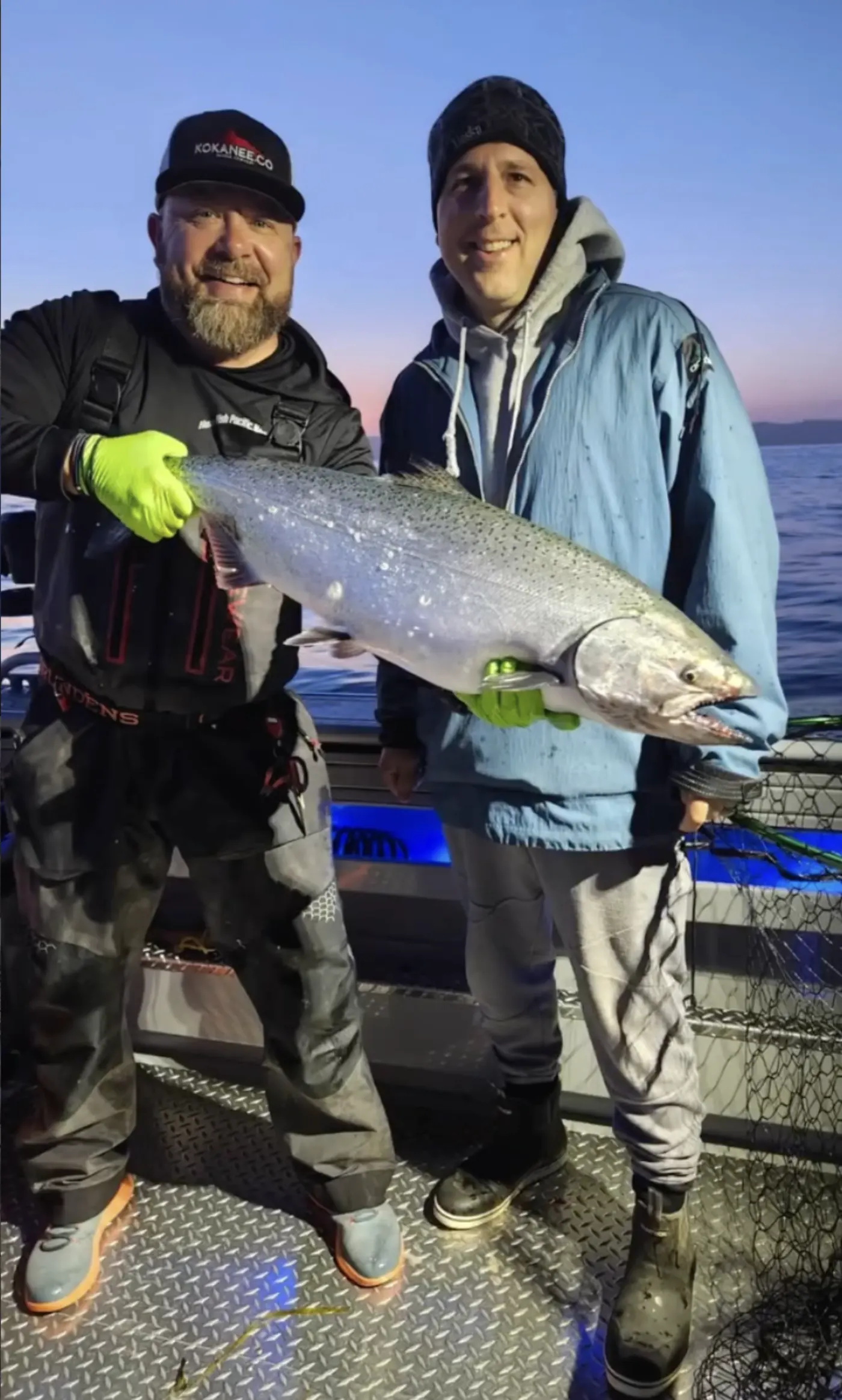 Guest holding a trophy king salmon at the Edmonds dock
